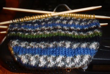 re-knit on size 2s, 8 stitches per inch. i'm experimenting with wider toes, since i tend to make them way to pointy