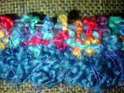 close up of stitches and yarn
